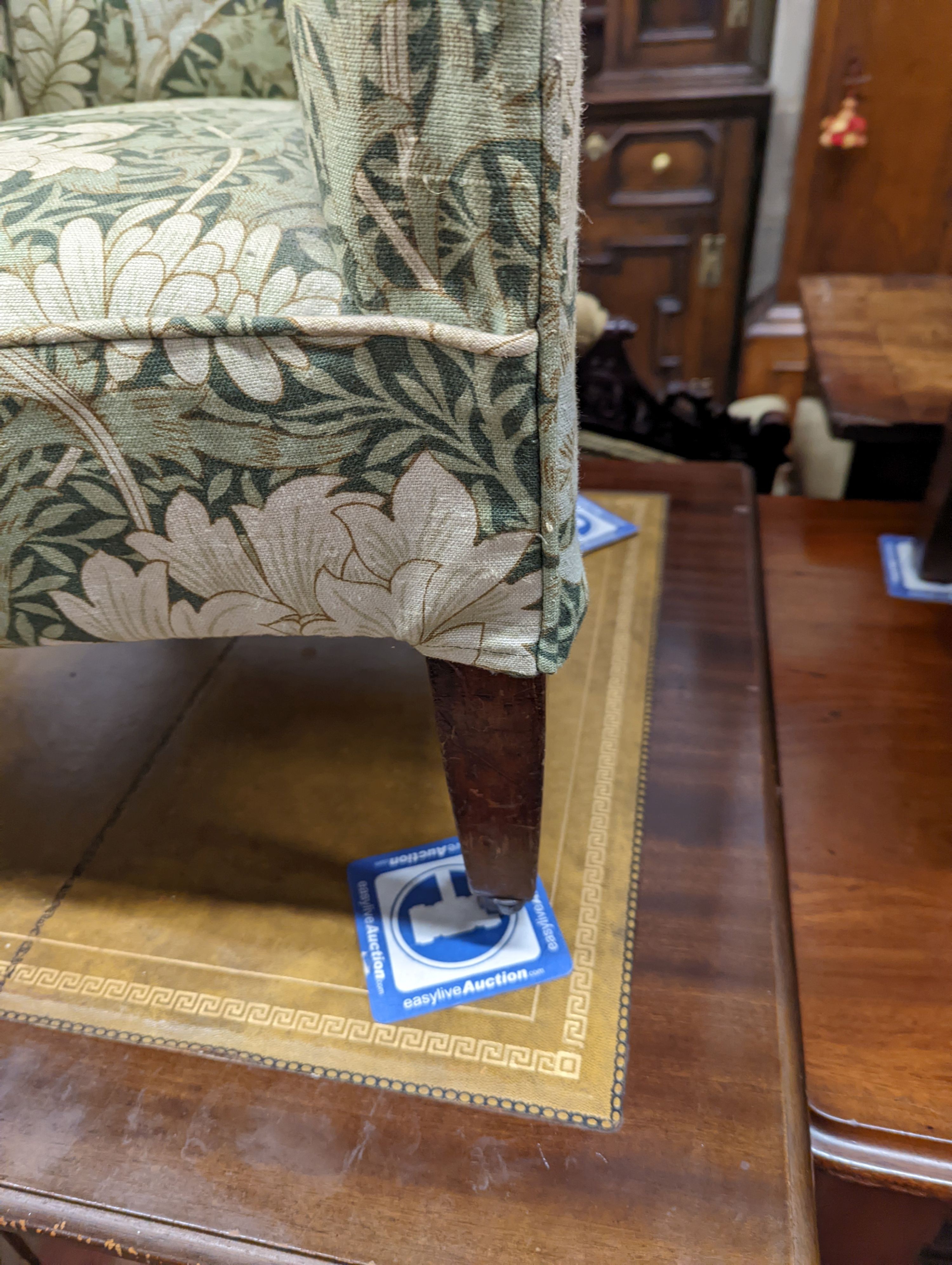 A George III mahogany child's armchair, with square tapered legs fitted brass castors, width 49cm, depth 48cm, height 78cm